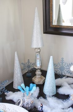 a table topped with blue and white decorations