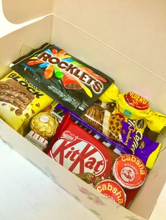 an open box filled with assorted snacks