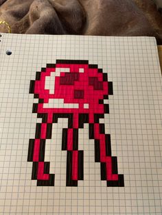 a notebook with an image of a red robot on it