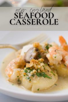 seafood casserole with mushrooms and parsley in a creamy sauce on a white plate