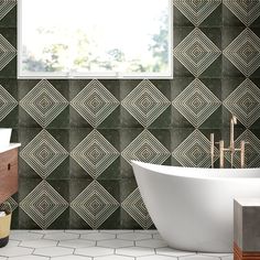 a bath tub sitting under a window next to a sink in a room with tiled walls