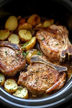 two pork chops and potatoes in the slow cooker