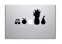 an apple, pears and pineapple sticker on the back of a macbook