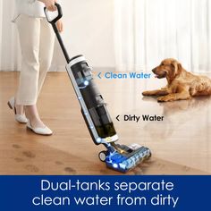 a woman is using a vacuum to clean the floor with her dog and cleaning supplies