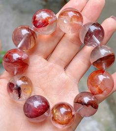 Material: Natural Red Hematoid Lepidocrocite Quartz beads  size :  19mm   quantity: one strand 6mm approx 29 pcs one strands 7mm approx25 pcs one strands 8mm approx 22 pcs one strands 9mm approx 21pcs one strands 10mm approx 19 pcs one strands 11mm approx 18pcs one strands 12mm approx 16 pcs one strands 13mm approx 16 pcs one strands 14mm approx 15 pcs one strands 15mm approx 14pcs one strands 16mm approx 14 pcs one strands 17mm approx 13pcs one strands 18mm approx 13pcs one strands 19mm approx Healing Bracelets With Large Beads, Large Beaded Round Crystal Bracelet For Gift, Red Crystal Bracelet With Natural Stones, Red Natural Stones Crystal Bracelet, Handmade Red Crystal Bracelet, Artisan Red Natural Stone Beads, Artisan Red Gemstone Beads, Elegant Red Multi-strand Beads, Large Red Carnelian Beads