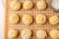 freshly baked powdered sugar cookies on a cooling rack