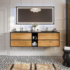 a bathroom vanity with two sinks and a large mirror over the sink in front of it