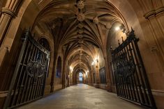 an empty cathedral with iron gates and lights