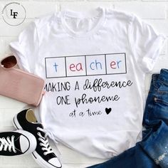 Product details:  TITLE NAME: Teacher Making A Difference One Phoneme At A Time Teacher Vintage T-Shirt, Teacher Shirt, Teacherlife Shirt, Teacher Lovers Shirt  IMPORTANT NOTE: Both Men and Women can we our shirts because this is unisex style t-shirts;  Wash item inside out in cold water, do not bleach, do not dry clean, do not iron directly on the design.  MATERIAL: 5.3-ounce, 100% cotton (99/1 cotton/poly (Ash) & 90/10 cotton/poly (Sport Grey); Heavyweight classic unisex tee; Taped neck and sh White T-shirt With Funny Text For Teacher Appreciation, Casual White T-shirt For Teacher Appreciation, White T-shirt With Name Print For Teacher Appreciation, White Text Print Shirt For Teacher Appreciation, White Crew Neck T-shirt For Teacher Appreciation, Style T Shirts, Making A Difference, Tee Shirt Designs, Make A Difference