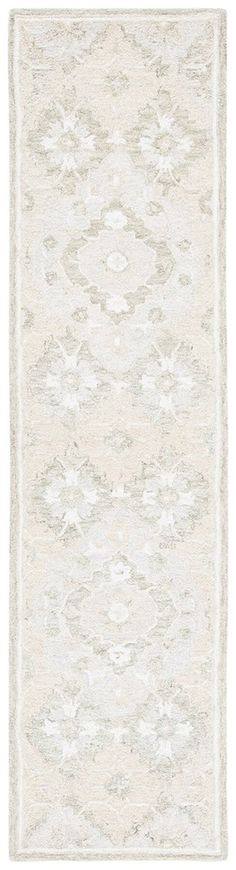 a white rug with an abstract design on the top and bottom part of it's border