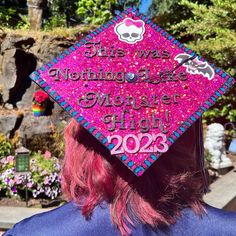 a woman with red hair wearing a pink graduation cap that says the was nothing else