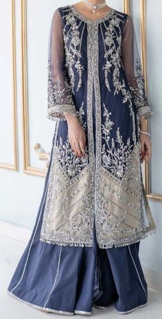 Perfect for special occasions and wedding gatherings, our statement blue front open jacket features silver appliqué on a navy tulle front. It is labor of extensive craftsmanship on a rather contemporary silhouette, making it an effortless style to pull off. Pieces Shirt Sharara & Undershirt Dupatta Formal Blue Embellished Sets, Blue Embellished Formal Sets, Elegant Royal Blue Sets For Reception, Elegant Blue Sets For Reception, Elegant Royal Blue Reception Sets, Elegant Royal Blue Set With Resham Embroidery, Blue Organza Sets With Long Sleeves, Blue Organza Long Sleeve Sets, Elegant Royal Blue Sets With Zari Work