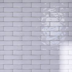 a white brick wall that has been painted