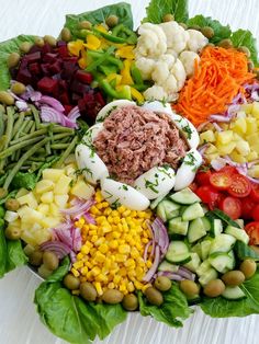 a large salad with many different types of vegetables