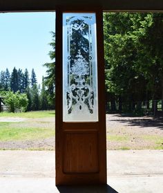 an open door with a glass design on it