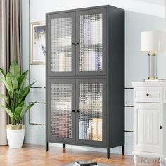 a grey cabinet with glass doors in a living room