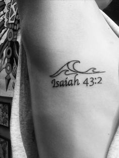 a woman with a tattoo on her arm that says, i am the lord and he is