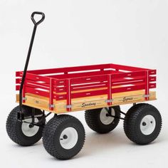 a red wagon with two black wheels