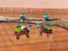 This beautiful turtle jewelry set is made by hand by the beautiful Quechua people of the Peruvian Andes.  It is made by silver and natural semiprecious gemstones of the region. (crystacola / peruvian turquiose, purple spondyllus .. ) BEST QUALITY ANDEAN ARTISAN WORK YOU CAN FIND.. weight : 7.8 gr width: 2.7 cm height: 1.5 cm  height with hook : 2.9 cm Traditional Multicolor Nickel-free Jewelry, Adjustable Multicolor Inlay Jewelry, Artisan Multicolor Jewelry With Inlay, Unique Multicolor Sterling Silver Jewelry, Bohemian Jewelry With Inlay As Gift, Bohemian Jewelry With Inlay For Gift, Multicolor Inlay Jewelry For Gifts, Southwestern Style Multicolor Nickel-free Jewelry, Bohemian Inlay Jewelry For Gift