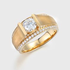 a yellow gold ring with diamonds on the sides and a white diamond in the center