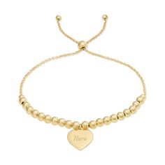 This Engravable Heart Tag Beaded Gold Bolo Bracelet is a classic accessory that adds just a bit of interest to your look.  Both petite and lightweight  this gold plated sterling silver 9" adjustable bolo bracelet can be worn alone or stacked with other bracelets.  Accented with a 1/2" engravable heart tag  perfect for adding a name  initial or monogram. Valentines Day Necklace, Coordinates Jewelry, Bolo Bracelet, Heart Tag, Monogram Jewelry, Anniversary Jewelry, Cz Stud Earrings, Personalized Valentines, Valentines Jewelry