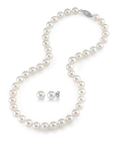 a white pearl necklace and earring set with an 18k white gold diamond clasp