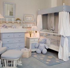 a baby's room with blue furniture and accessories