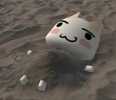 an animated image of a cat in the sand with marshmallows around it