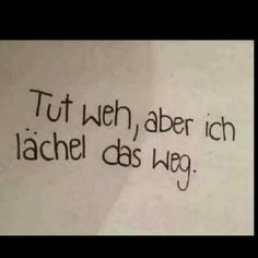 the words are written in black ink on white paper, which reads tut weh aber ich lauchen des weg