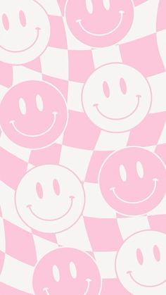 a pink and white checkered pattern with smiley faces