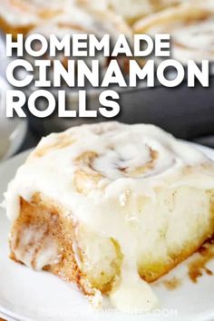 cinnamon rolls with cream cheese frosting on a white plate