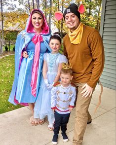 a man and two children are dressed up as princess aurora and the frog prince with their parents