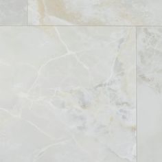 a white marble tile floor with an abstract design