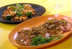 two plates of food on a yellow table