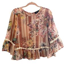 New Without Tags! Never Worn. In Great Condition. No Flaws! Features Crotchet Design At Bell Sleeves And Hem. Stripe And Floral Design In Beautiful Earth Tone Colors. 100% Polyester. Pink Floral Print Chiffon Tops, Pink Chiffon Tops For Beach, Casual Pink Chiffon Blouse, Flowy Pink Chiffon Blouse, Spring Chiffon Tops With Lace Trim, Spring Bohemian Chiffon Tops, Floral Print Chiffon Blouse For Vacation, Chiffon Tops With Lace Trim For Spring, Feminine Chiffon Blouse For Vacation