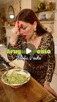 a woman standing in front of a bowl of food