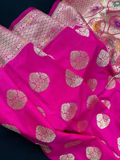 Beautiful Pink color Banarasi Handloom Saree with Gold Zari Weaving Buttas and floral borders with Meenakari Work. The pallu of the saree is grand and with Meenakari Work.  Material is very soft and easy to drape and carry.   Item : Saree Color : Pink Base Fabric :  Soft Banarasi Silk  Blouse piece : Comes with Blouse piece Blouse material : Soft Banarasi Silk  Fall & Edging: Comes with Fall and edging (Pico) and tassels attached  Occasion: Party, Wedding, Festival, Wedding, Traditional, Religious, House-warming, Social Gatherings and Celebrations.  Disclaimer -: - Color variation is possible due to various reasons like phone or desktop setting, resolution etc. Please don't hold us responsible. Our aim is to put the exact color of the Saree. - If the Saree is Pure Silk, we will put it very Pink Meenakari Choli For Festivals, Traditional Pink Anarkali Set With Pallu, Pink Chandbali Dupatta For Traditional Ceremonies, Pink Meenakari Anarkali Set For Navratri, Festival Paithani Silk Choli With Traditional Patterns, Pink Meenakari Saree For Traditional Ceremonies, Festive Meenakari Paithani Silk Choli, Traditional Meenakari Katan Silk Wear For Festivals, Unstitched Meenakari Traditional Wear For Diwali