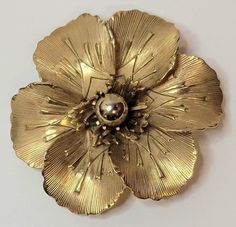 "Plain goldtoned pretty little flower brooch with gold bead center by Giovanni.  Circa/Year: 1950's/60's Measurements: About 1.75\" diameter. Label/Backstamp: GIOVANNI Material: Metal. Condition: Clasp works well. Very good overall condition. Item is USED and VINTAGE so it does show normal age, wear and tear. Please view all photos." Vintage Gold Brooch Pin, Elegant Gold Flower Brooches, Victorian Gold Flower Brooch, Vintage Yellow Gold Flower Brooches, Vintage Gold Flower Shaped Brooch, Art Deco Brooch, Horse Carriage, Brooch Bouquets, Bisque Porcelain