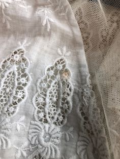 "Antique Edwardian white cotton lawn dress has eyelet lace embroidery throughout the bodice, sleeves, and around the hem. The dress has a ruffle trimmed net collar and net under bodice that has a crossover snap detail. The dress has snap and hook and eye closures at the skirt and bodice. Condition Overall excellent. There's a repair to the right sleeve, and orange stains near the seam. The front skirt has stains at the hem, the back skirt has some stains near the top of the lace, and yellowing a White Regency Broderie Anglaise Dresses, White Broderie Anglaise Regency Dress, White Regency Style Broderie Anglaise Dresses, Elegant White Cotton Victorian Dress, White Cotton Lace Dress With Lace Work, White Broderie Anglaise Victorian Wedding Dress, White Elegant Victorian Dress With Broderie Anglaise, White Cotton Victorian Dress For Summer, White Victorian Wedding Dress With Broderie Anglaise