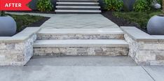 steps leading up to the front door of a house with landscaping and plants around them