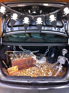 the trunk of a car with skeleton decorations