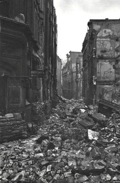 black and white photograph of rubble in an old city