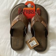 Brand New Never Worn. Dark Brown / Tan. Casual Brown Flip Flops With Leather Footbed, Casual Brown Leather Flip Flops, Brown Synthetic Round Toe Flip Flops, Brown Casual Slip-on Flip Flops, Brown Casual Flip Flops With Cushioned Footbed, Comfortable Brown Round Toe Flip Flops, Casual Brown Flip Flops With Cushioned Footbed, Comfortable Brown Flip Flops, Brown Cushioned Flip Flops With Round Toe