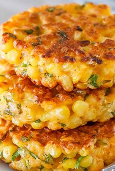 corn fritters stacked on top of each other with the words corn fritters above them