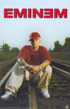 a man sitting on top of train tracks next to the words meme written in red