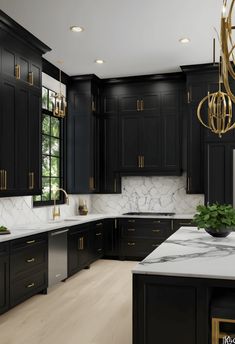 a large kitchen with black cabinets and marble counter tops, gold accents on the doors