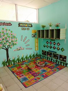 a brightly colored room with a tree painted on the wall