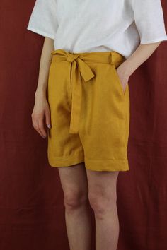 "Women linen shorts with 2 pockets in mustard color, perfect for casual wear and suitable for any occasion in any season Details: - 100% natural linen produced in Europe ; - medium weight (180 gram per square meter); - color: mustard, can be any from our colors catalogue (color samples at the photo); Made to order, approximately a few days, If you have any questions please message me and I will be glad to answer. Size guide : Size XS Bust: fits bust around 33\"-34\"/ 84-88 cm Waist: fits waist a Solid Knee-length Summer Shorts, Solid Linen Shorts With Built-in Shorts, Solid Linen Shorts, Yellow Relaxed Fit Shorts For Summer, Relaxed Fit Yellow Shorts For Summer, Knee-length Summer Shorts, Summer Knee-length Shorts, Knee-length Beach Shorts, Linen Shorts With Pockets