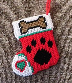 an ornament shaped like a stocking with a dog's face on it