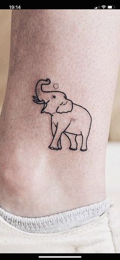 an elephant tattoo on the ankle is shown in black ink, and it looks like he's eating something